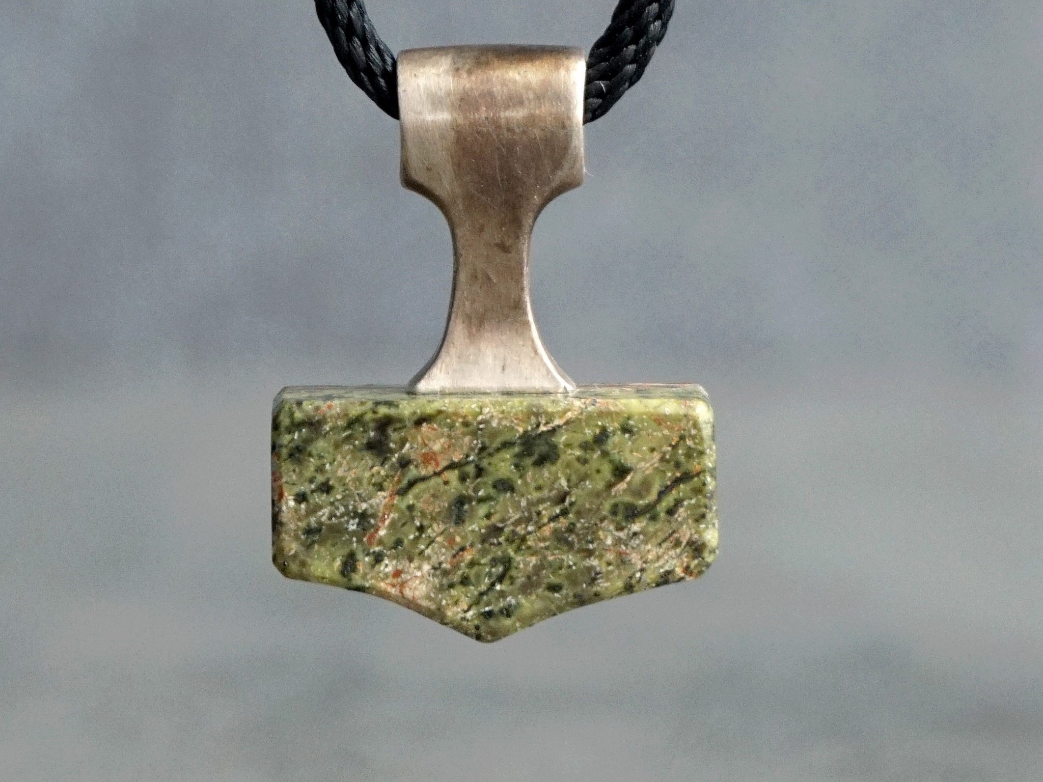silver and Serpentine stone in light green colour with black inclusions