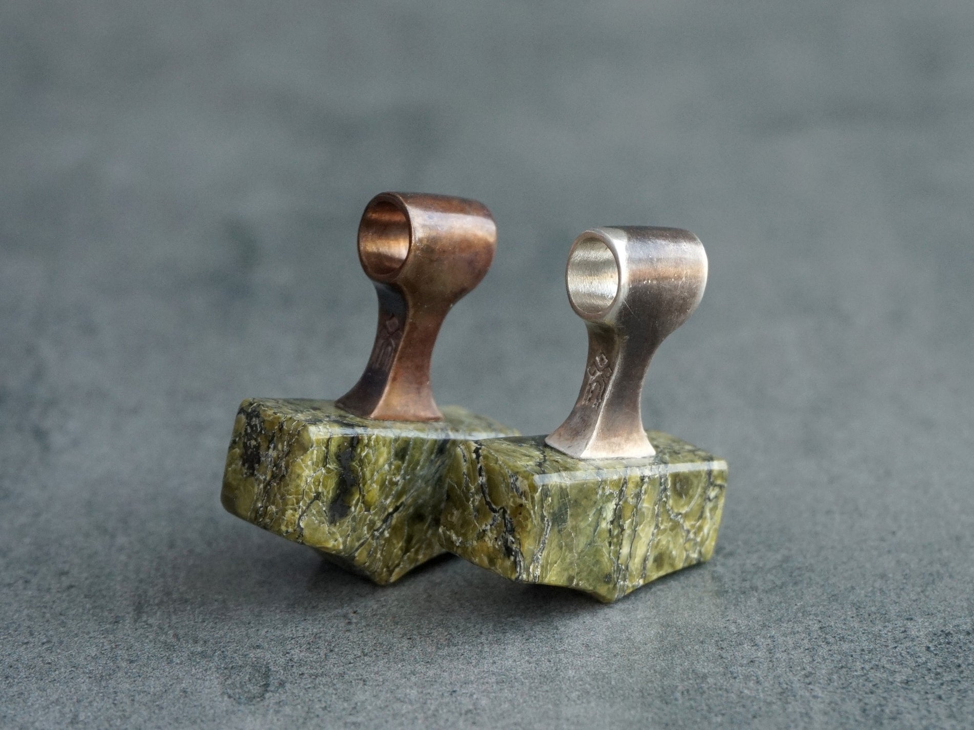 silver and bronze pendants with green Serpentine stone
