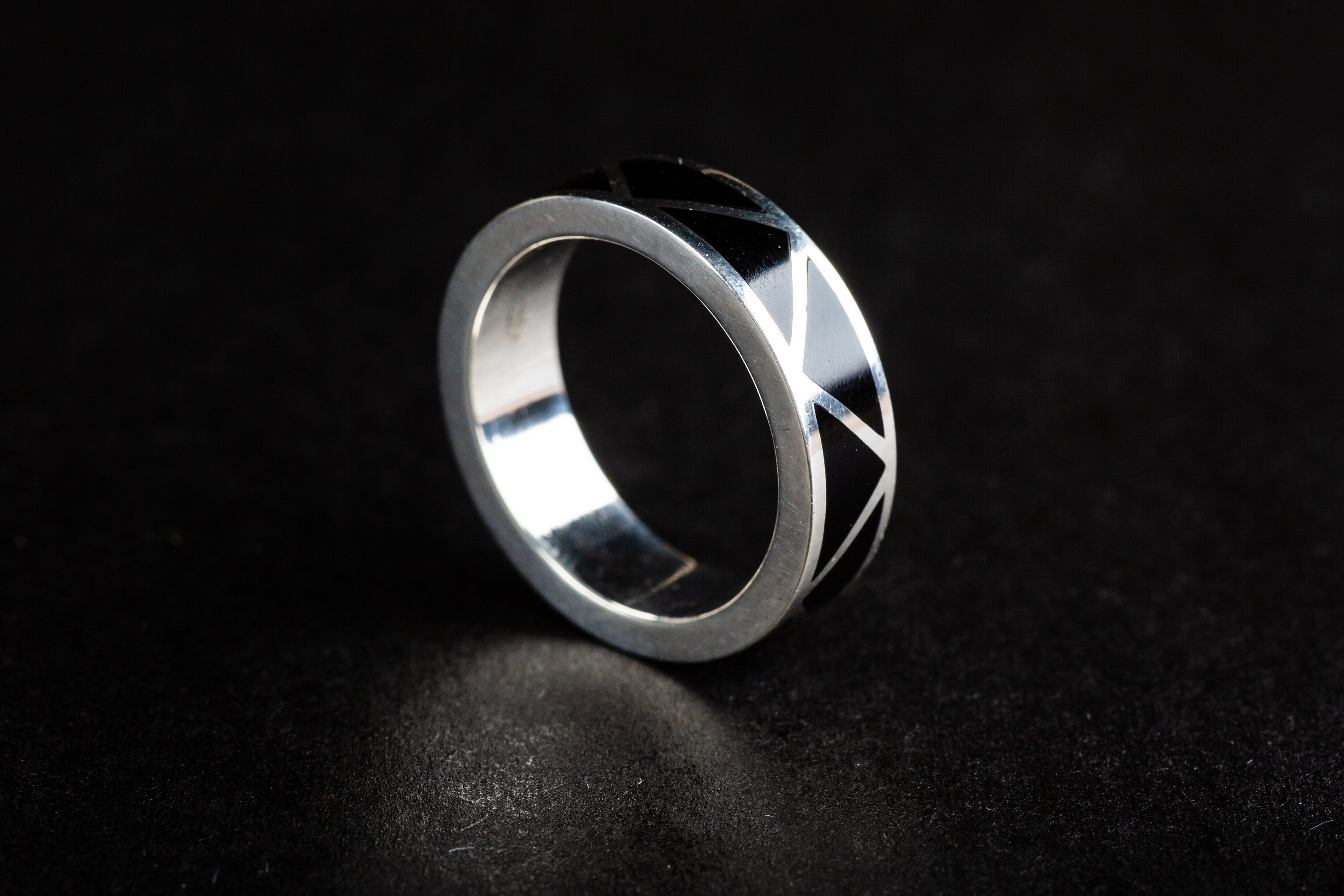 silver ring inlaid with black onyx