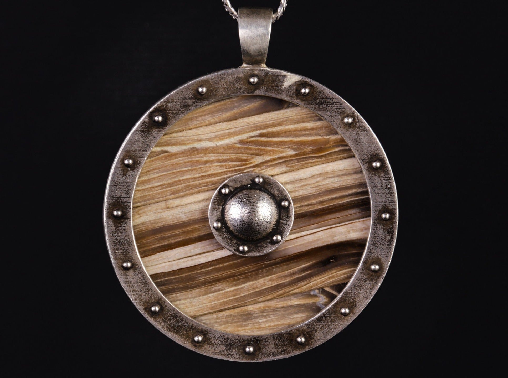 silver shield with wooden planks