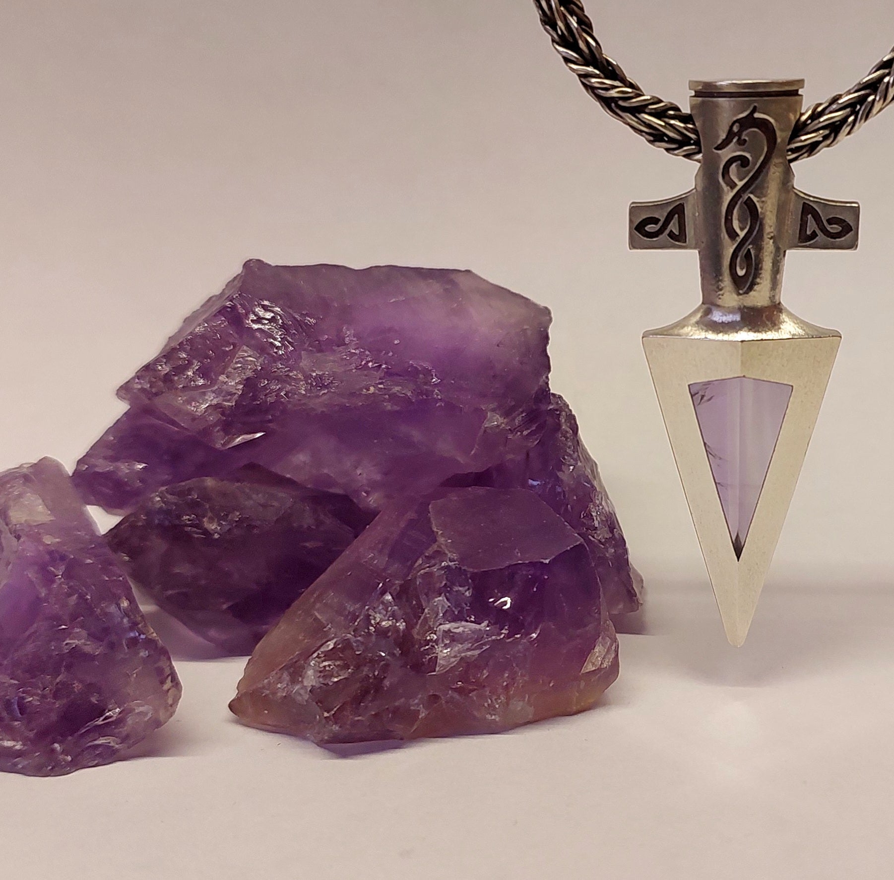 Pieces of amethyst mineral and Odin’s silver spear with an amethyst set in it.
