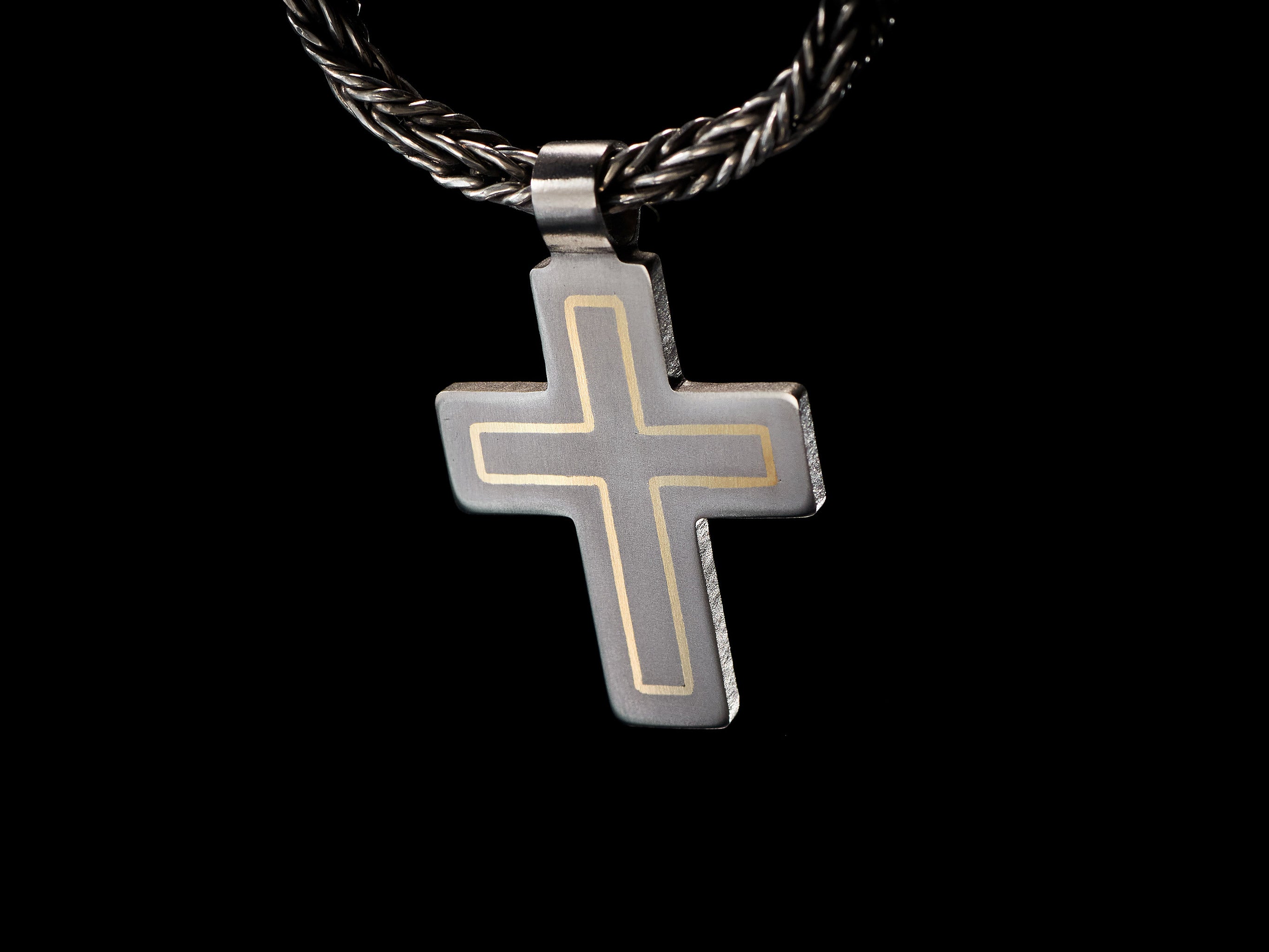 Modern titanium cross pendant with brass inlay. Minimalist cross necklace
