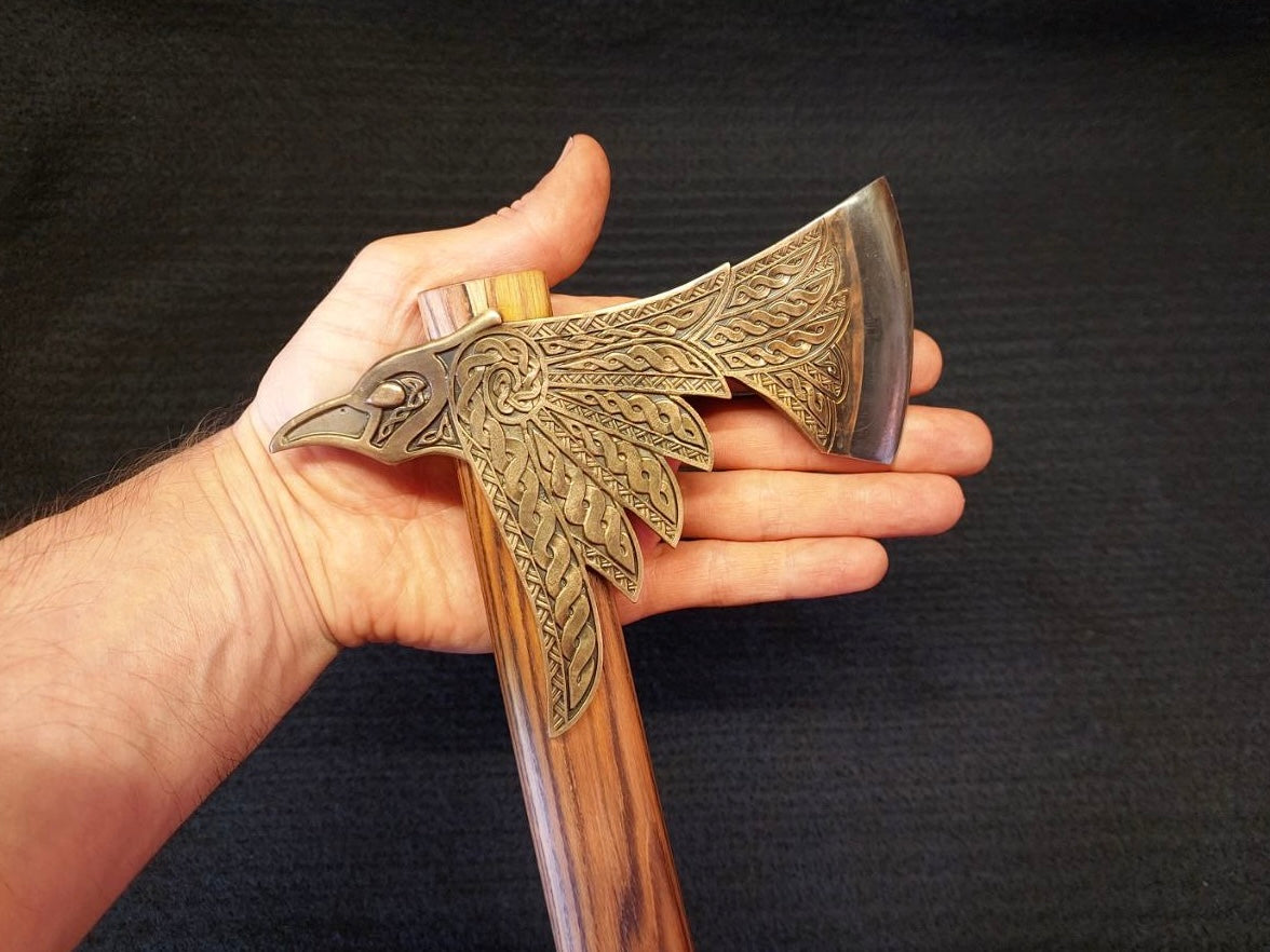 Top profile view of handcrafted bimetallic Raven Viking axe
