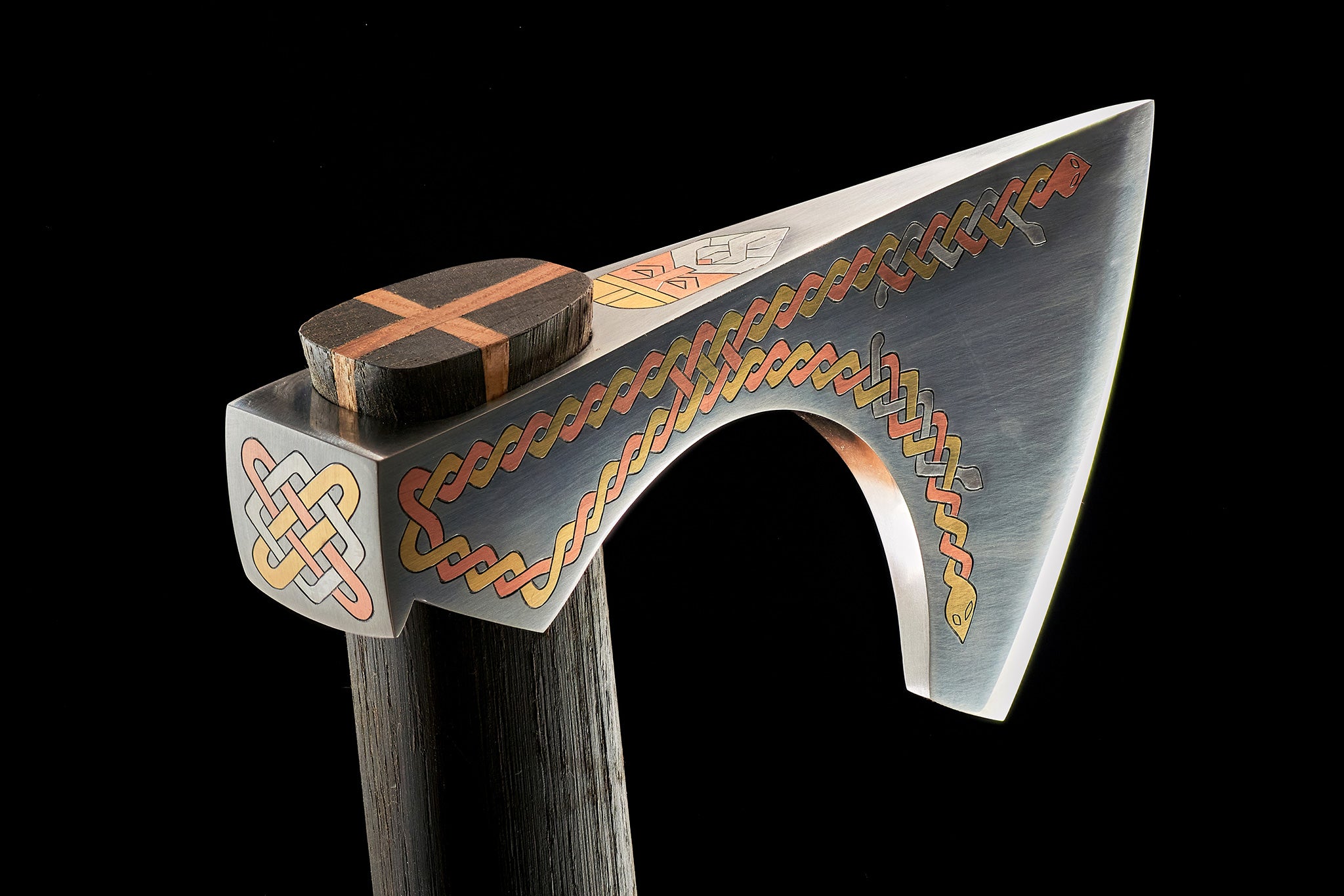 Celtic ornaments across all sides of collectible axe sculpture
