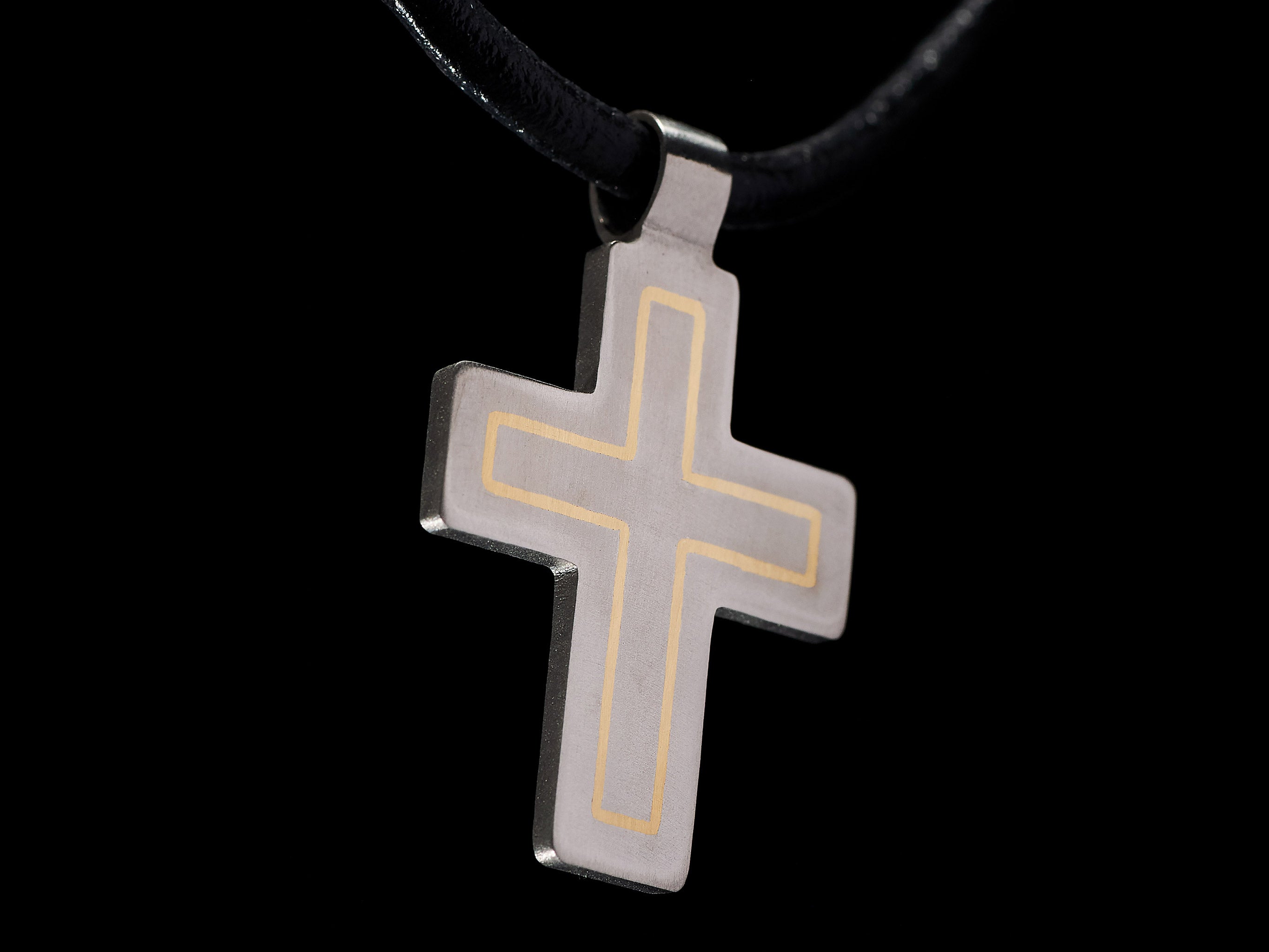 macro detail titanium cross brass inlay handcrafted engraved lines