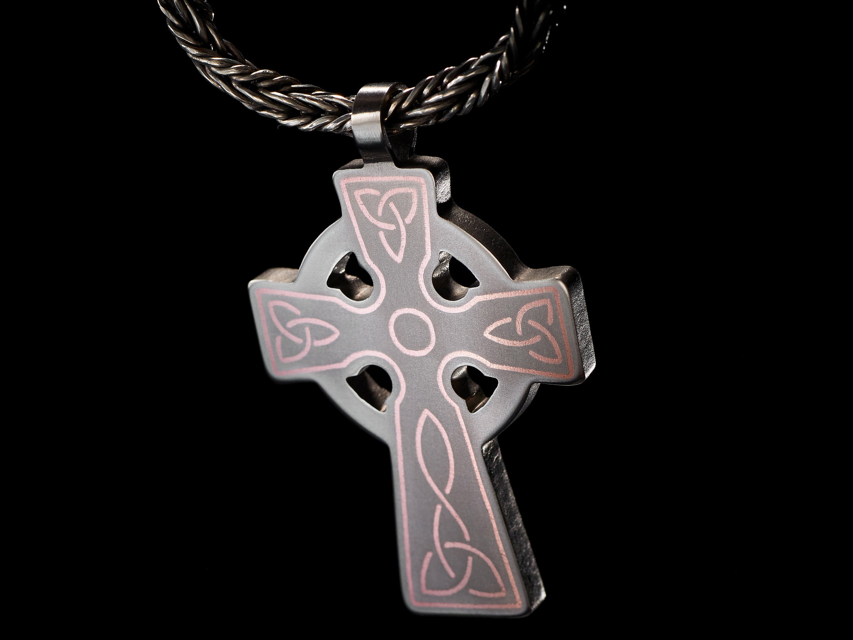 detail of titanium celtic cross pendant copper inlay