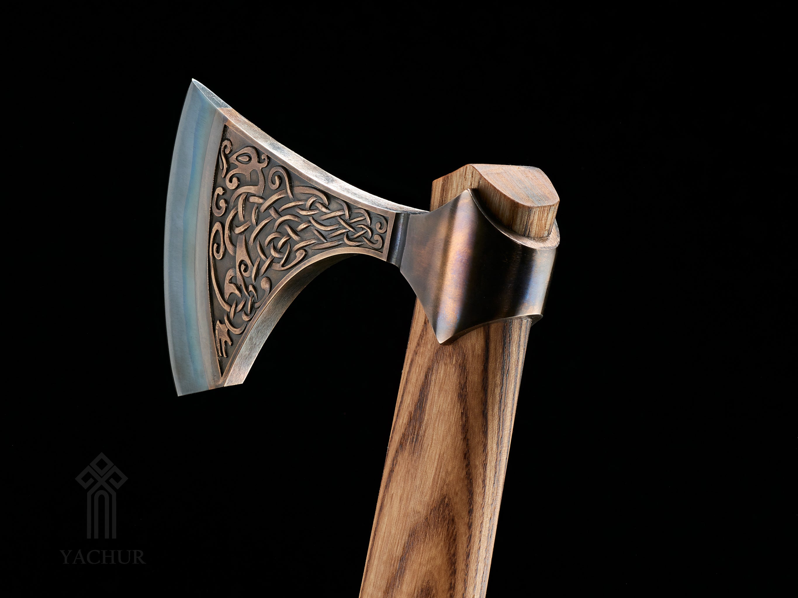 Detailed view of Urnes style ornamentation on handcrafted bronze axe head