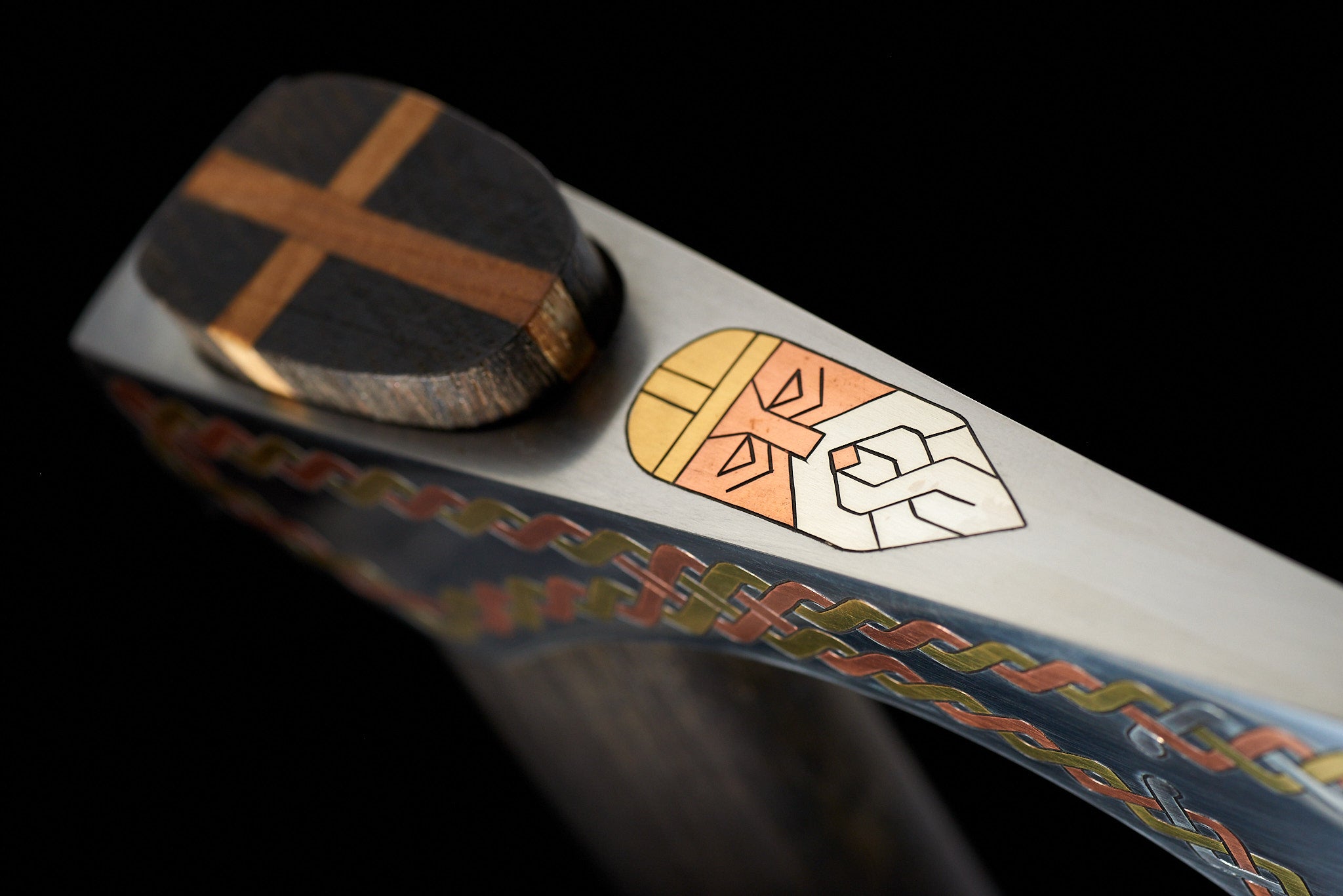 Stylized Viking figure detail on handcrafted collectible axe