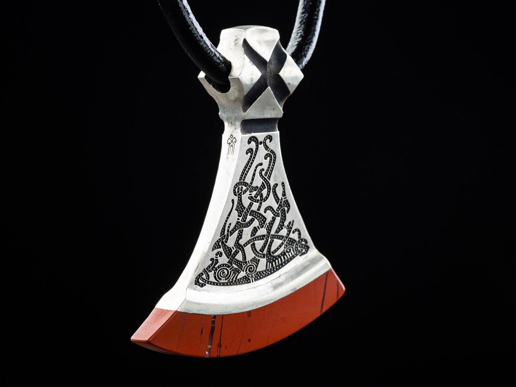 foliate ornament of a silver axe