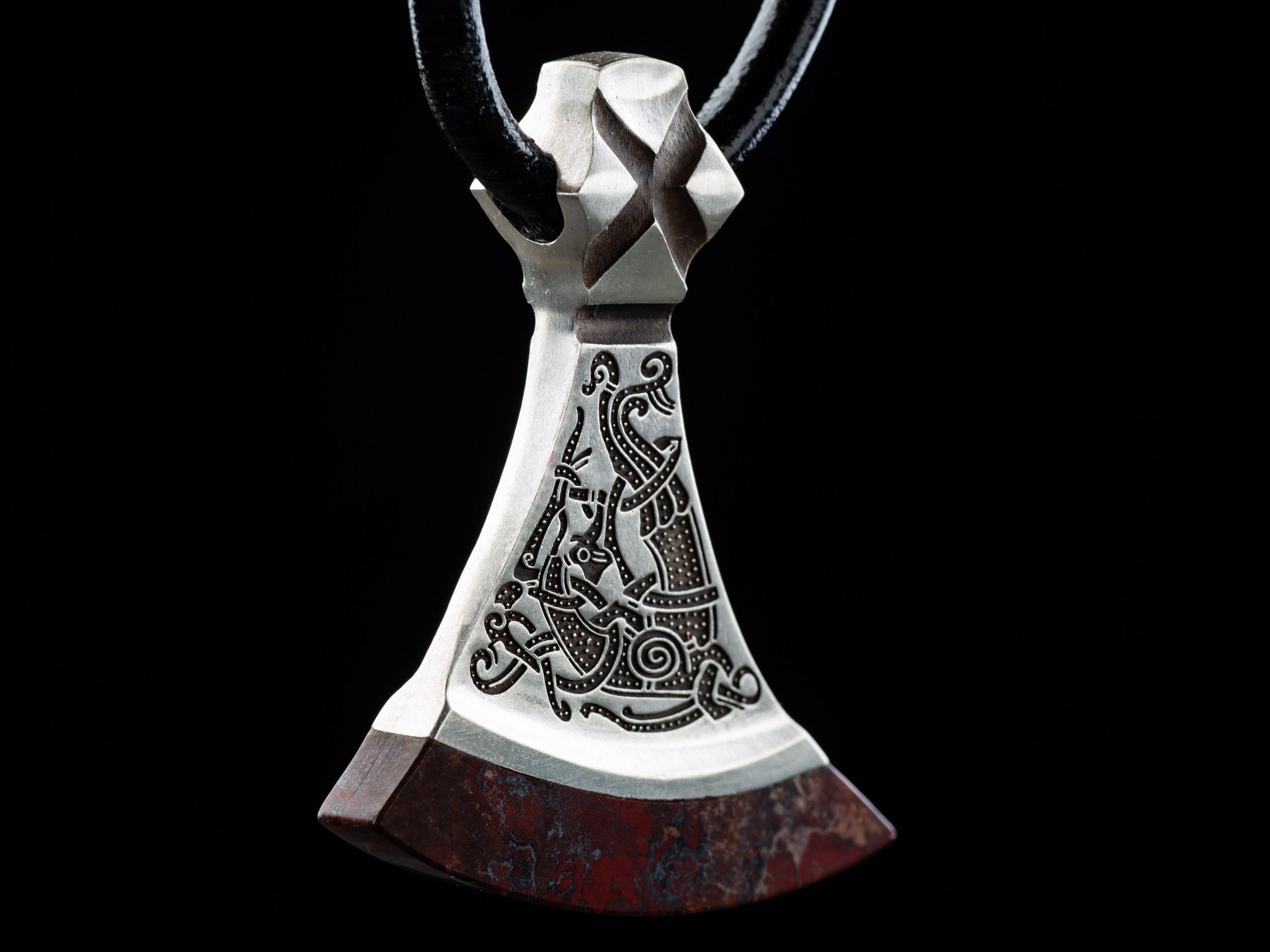 large silver axe with bird ornament 