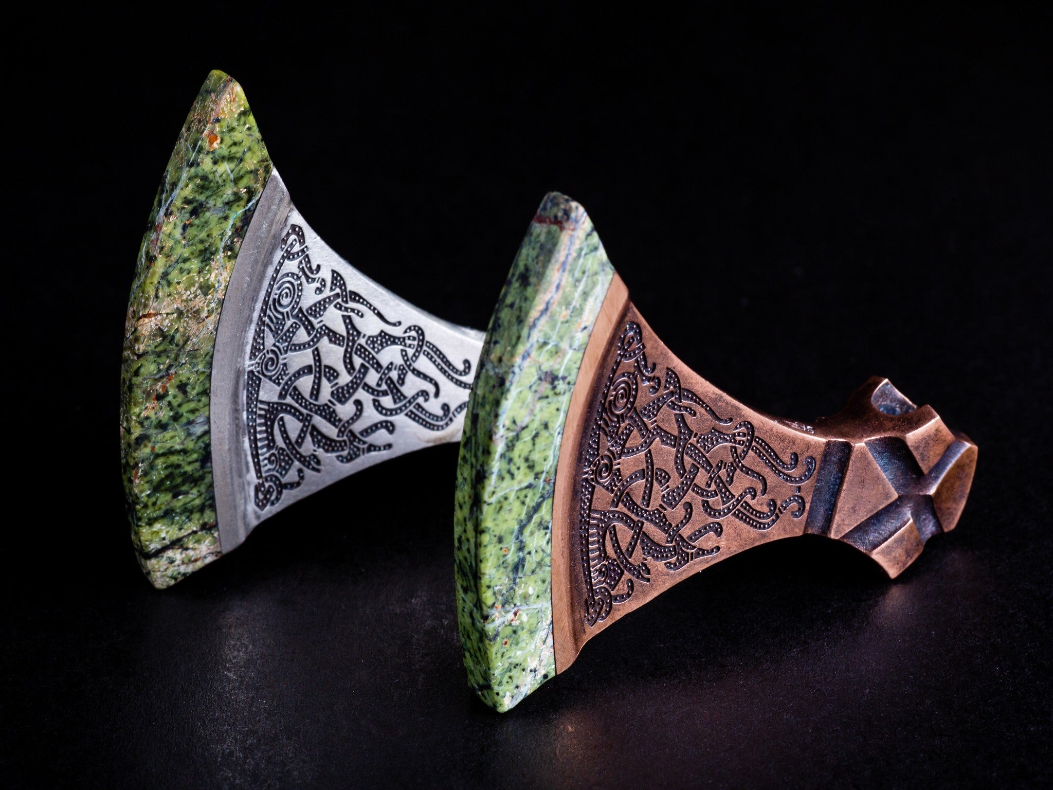 green stone blades of axes with black inclusions in the stone