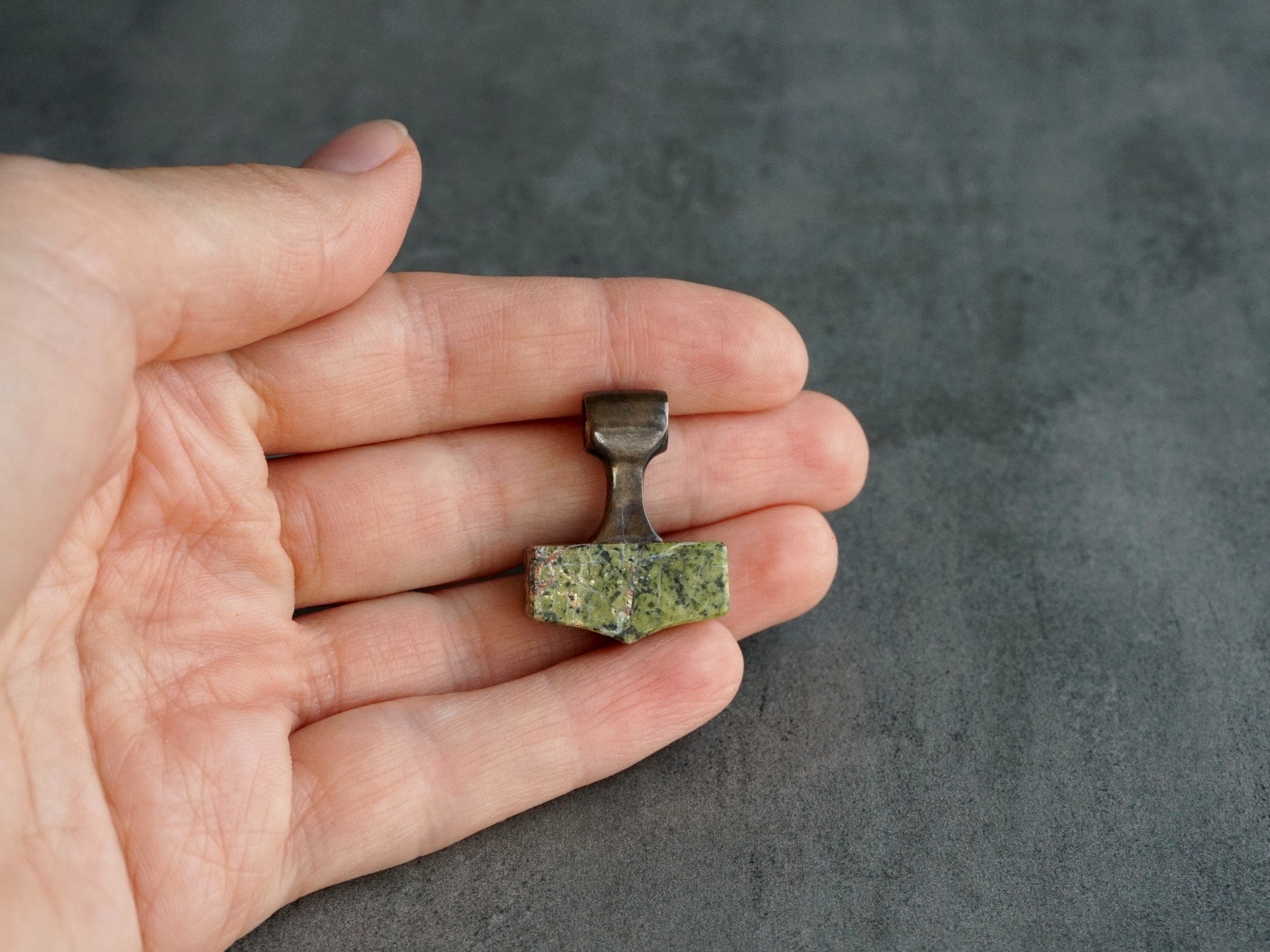 small bronze and green stone hammer