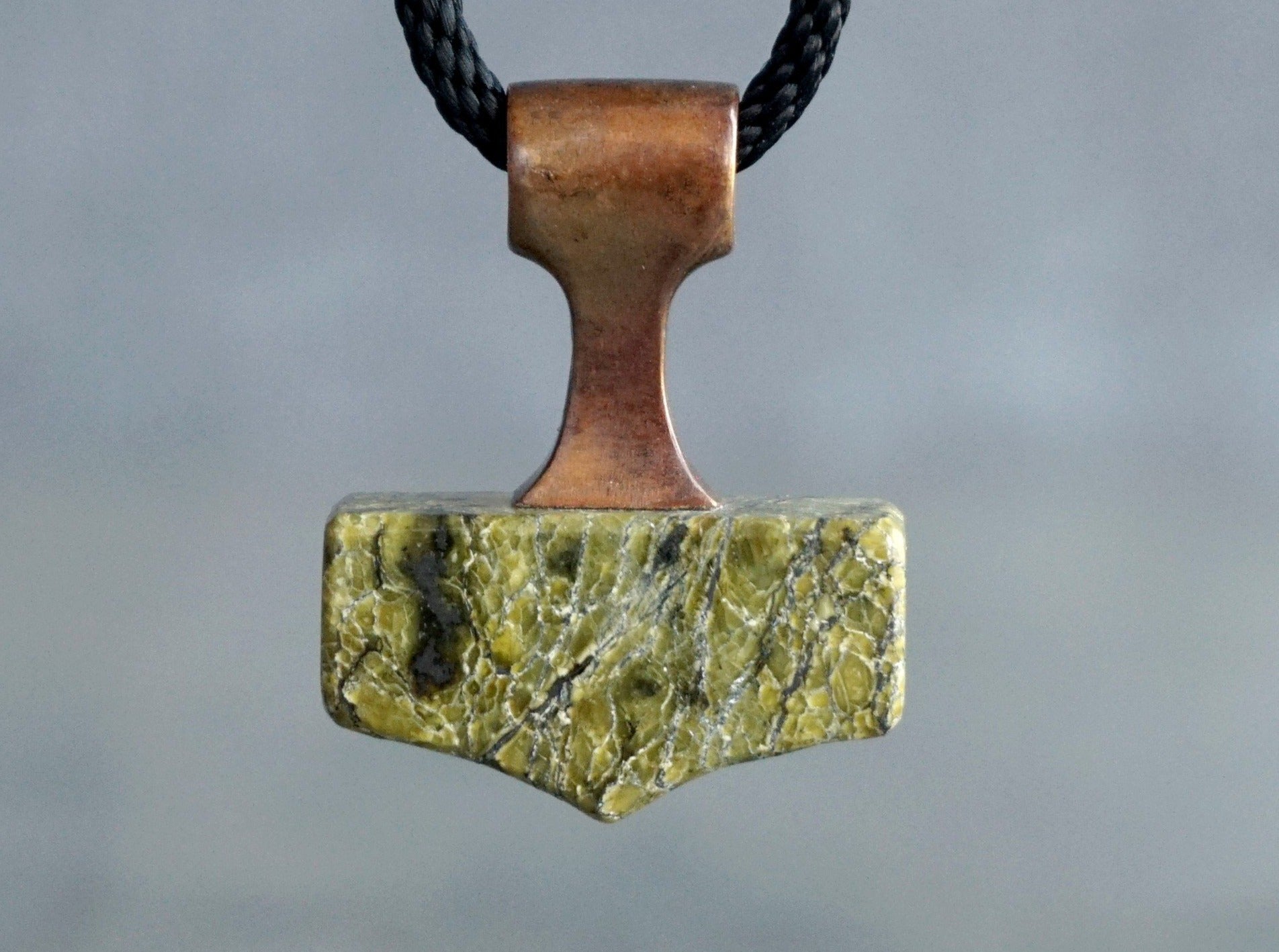 bronze and green Serpentine mjolnir amulet