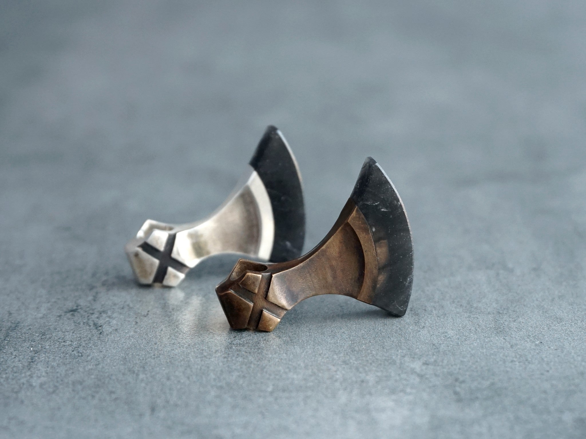 small silver and bronze axes with obsidian blades