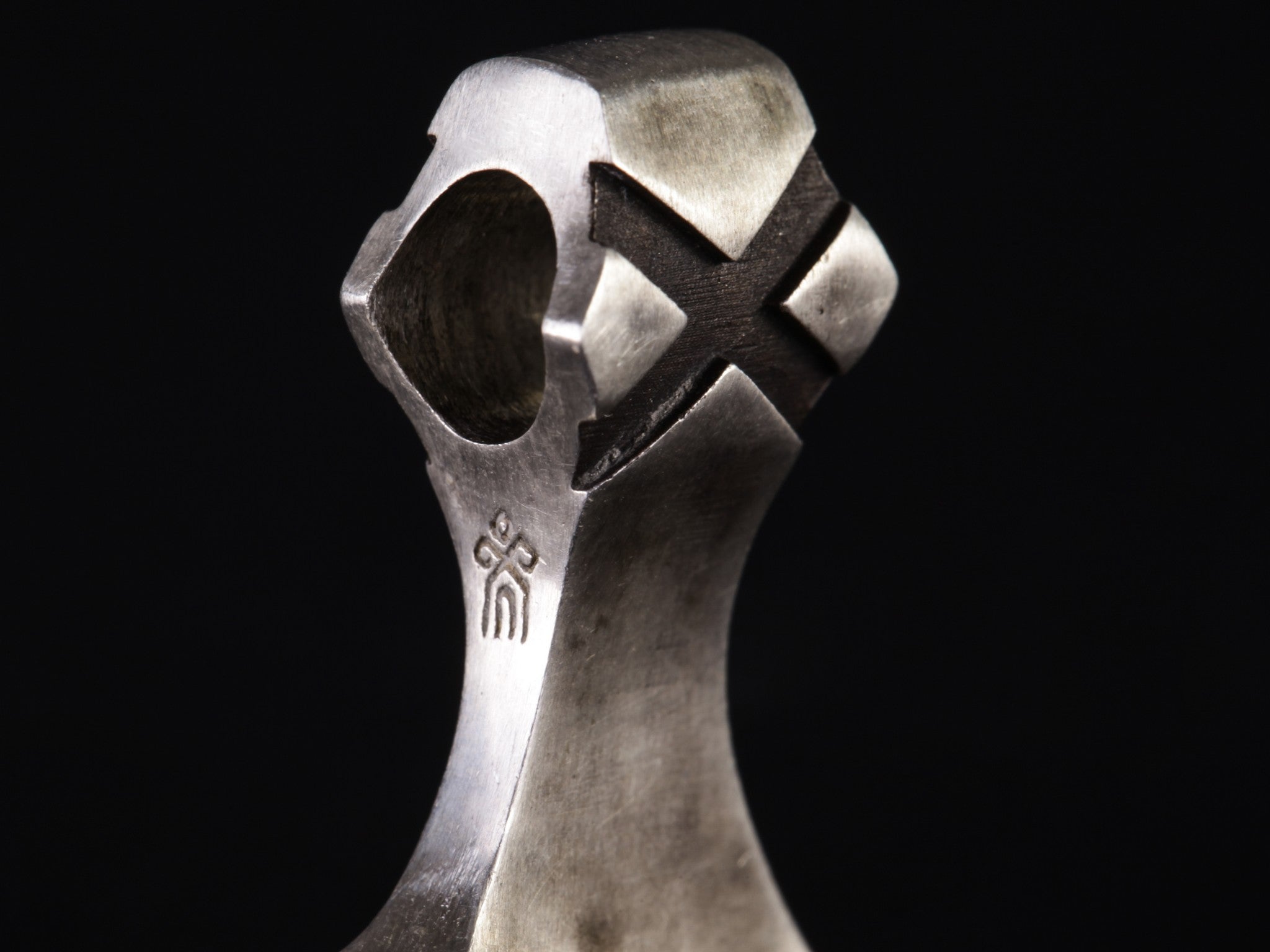 shop's logo on silver axe pendant