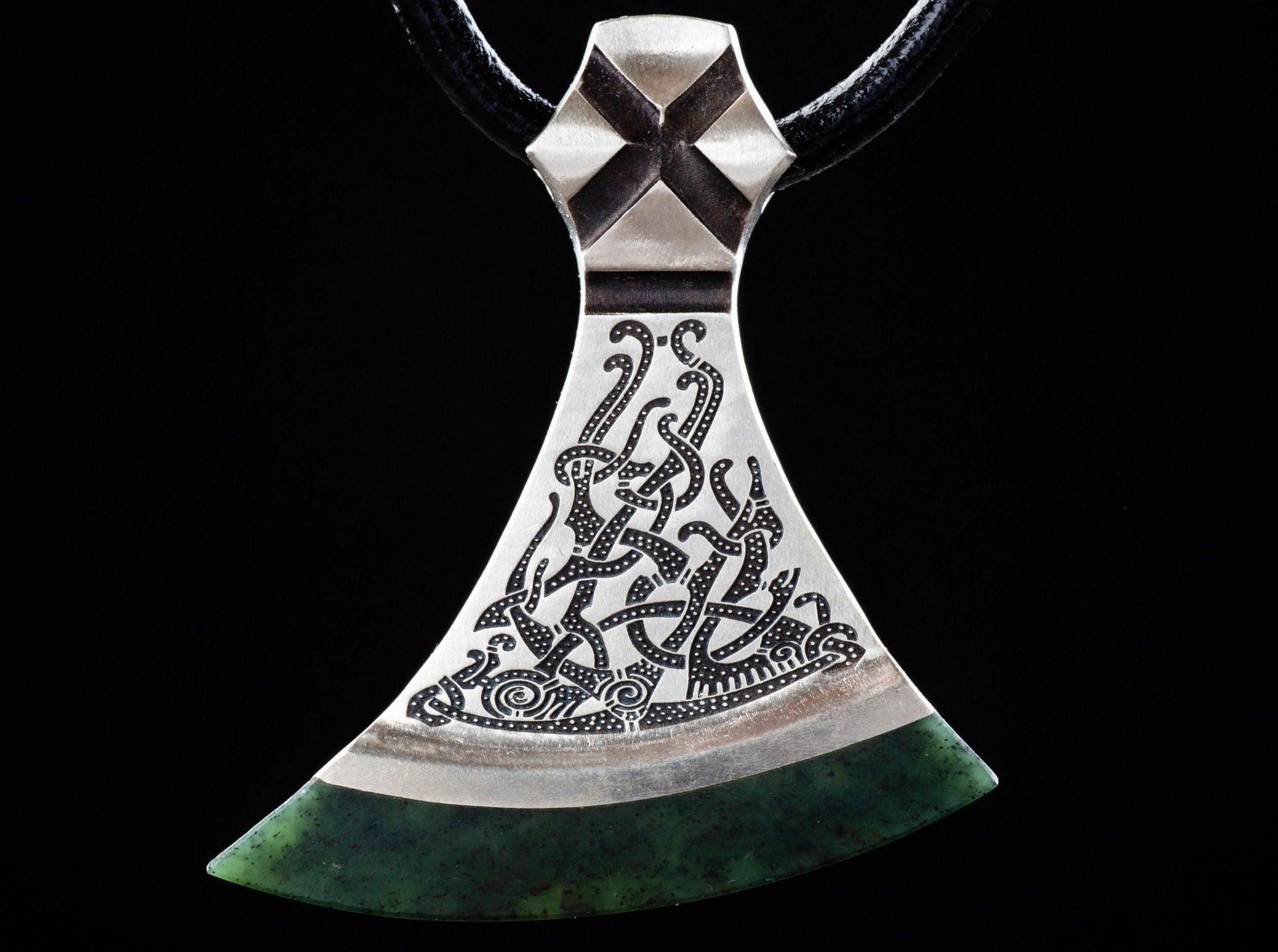 foliate ornament on a silver axe