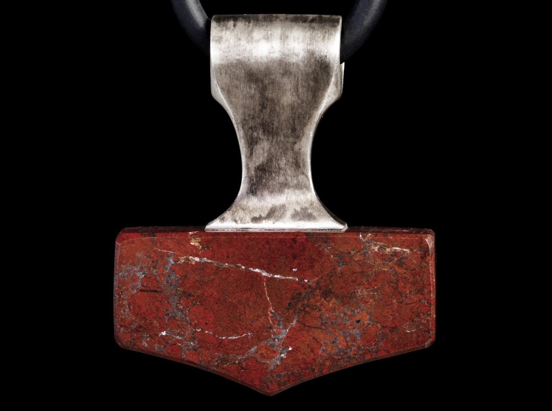 silver and red stone mjolnir amulet
