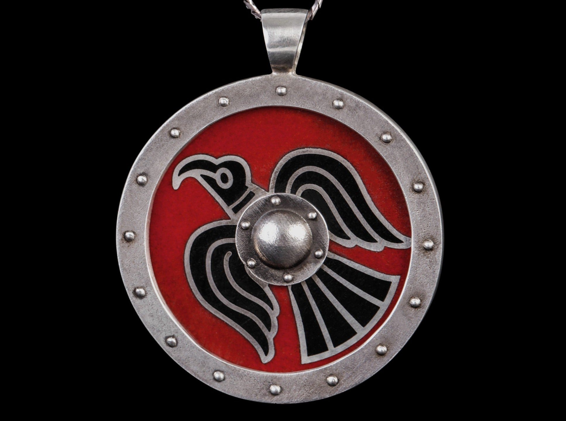 silver shield with raven symbol