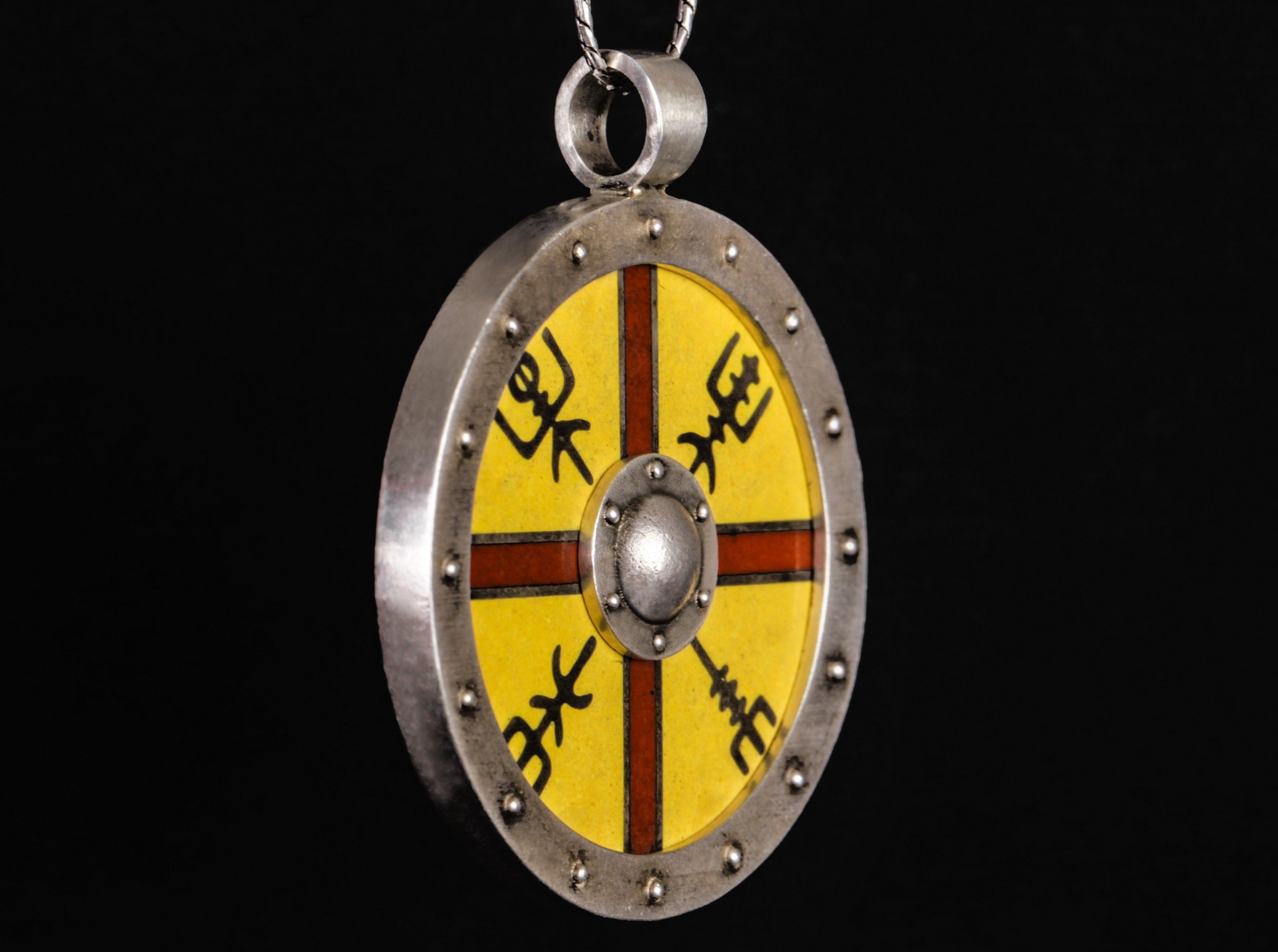 silver shield with red cross and silver runes on the yellow background 