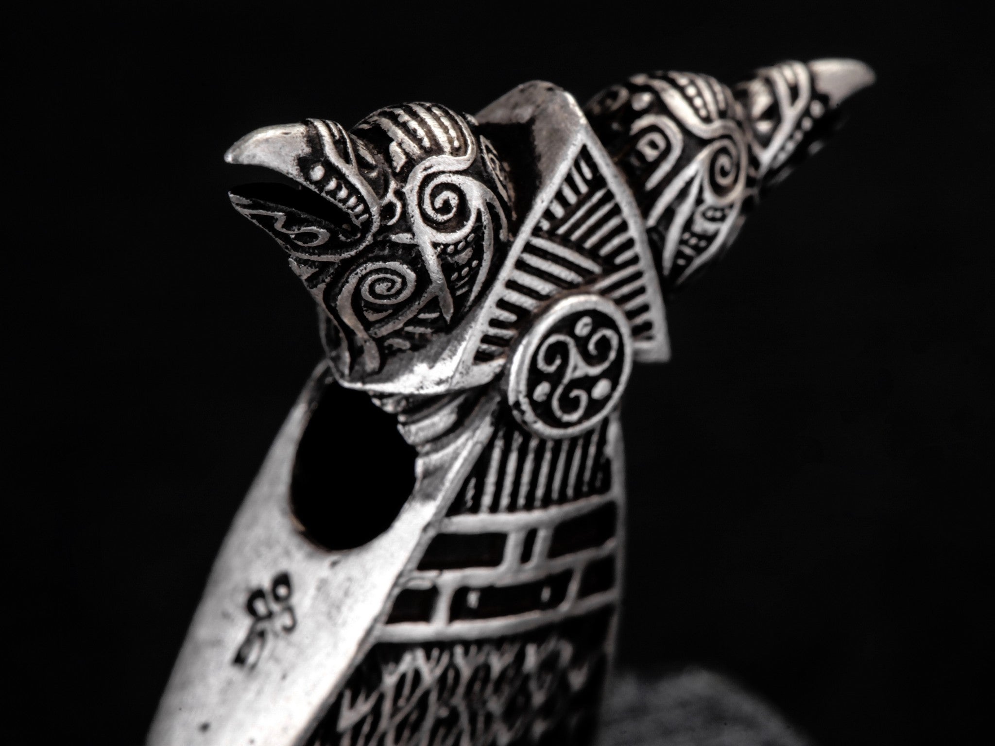 siver ravens heads decorated with Celtic ornament