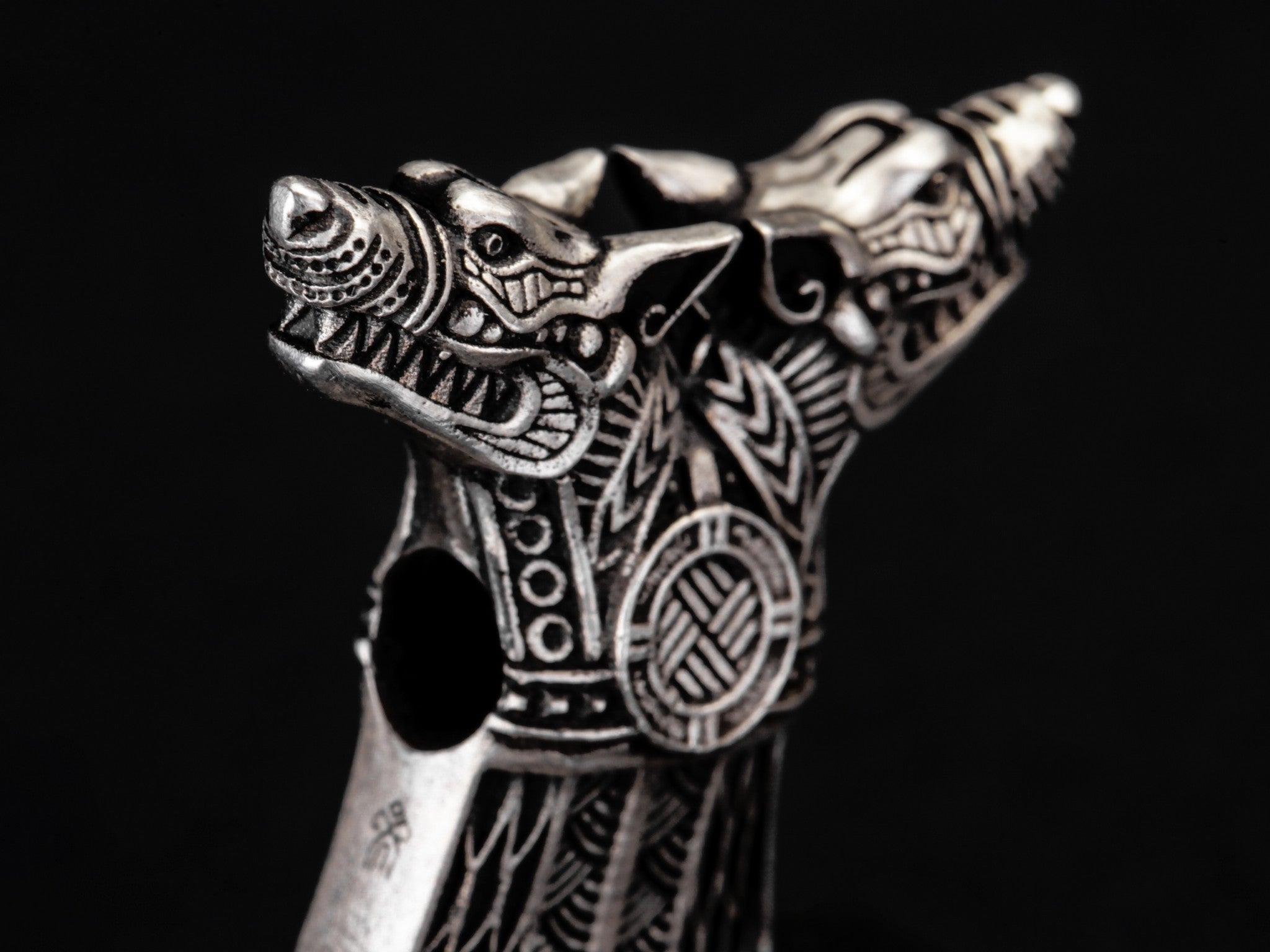 silver celtic style wolves heads